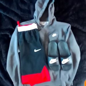bundle nike sweatshirt size medium, slides size 9.5 an basketball shorts size sm
